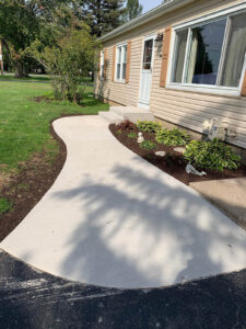 Broom finish sidewalk with stoop and step