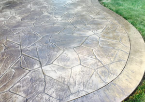 Pattern: Large Random Flagstone - Colors: Hiltop Tan With Walnut Release And Autumn Brown Border
